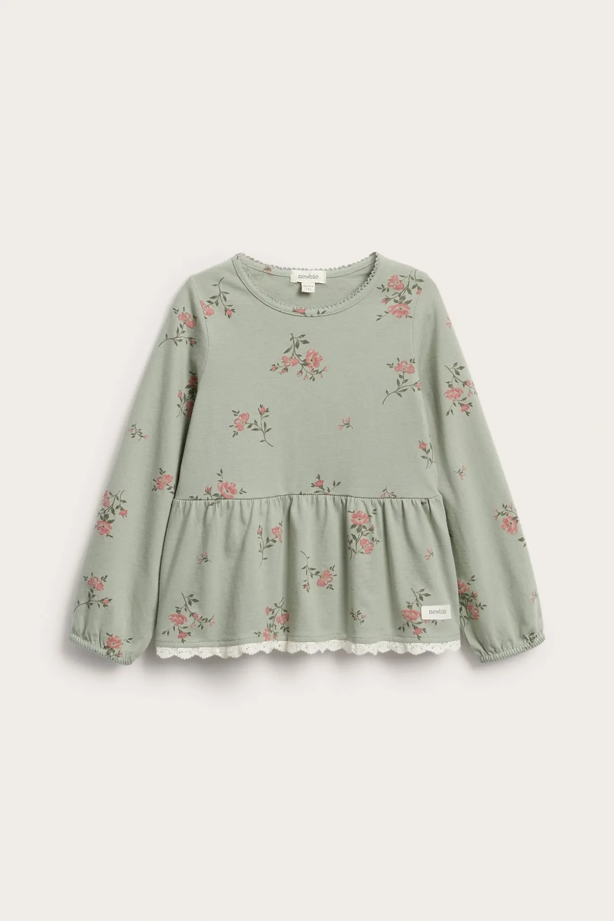 Blommig långärmad peplumtopp