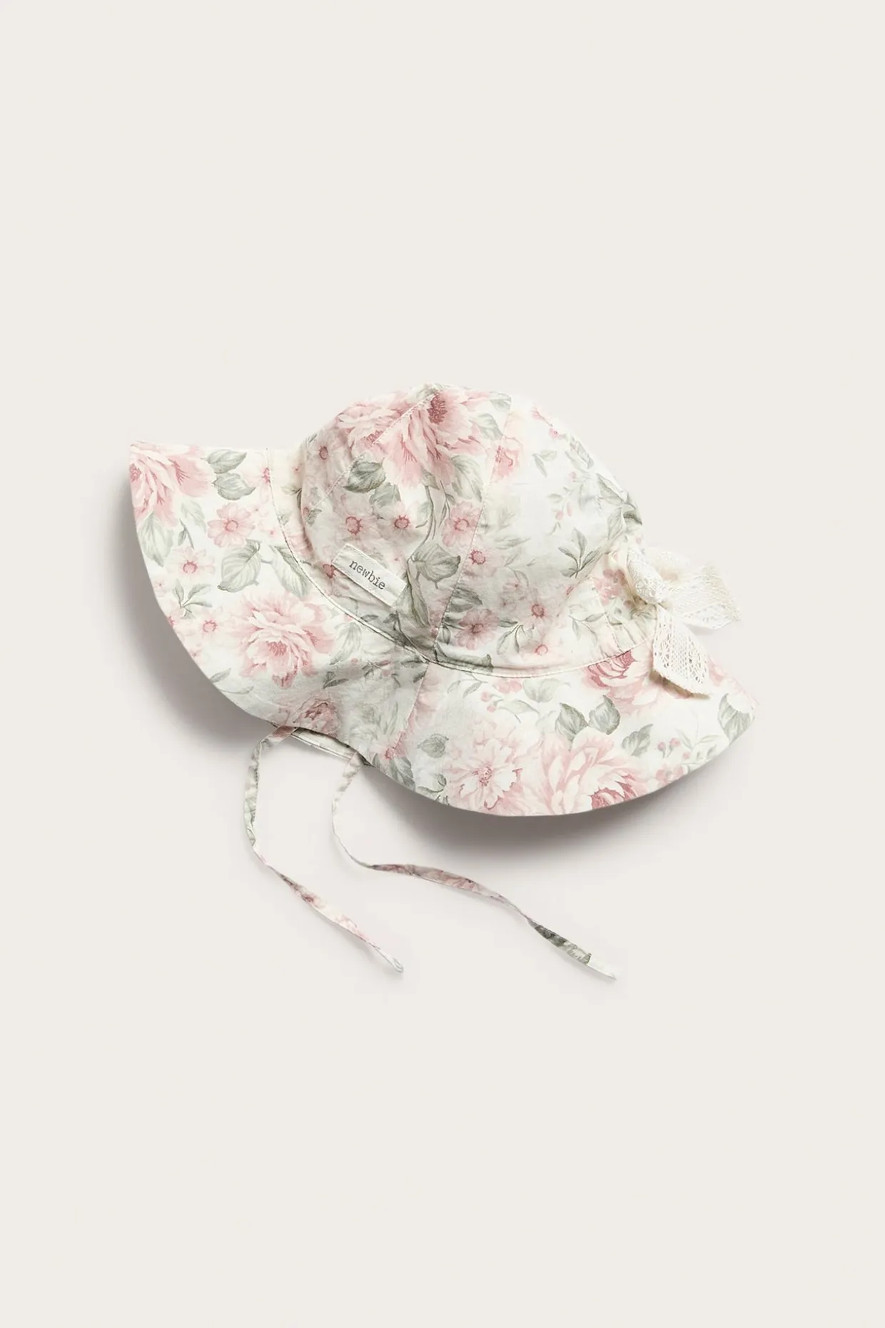Blommig solhatt med rosett