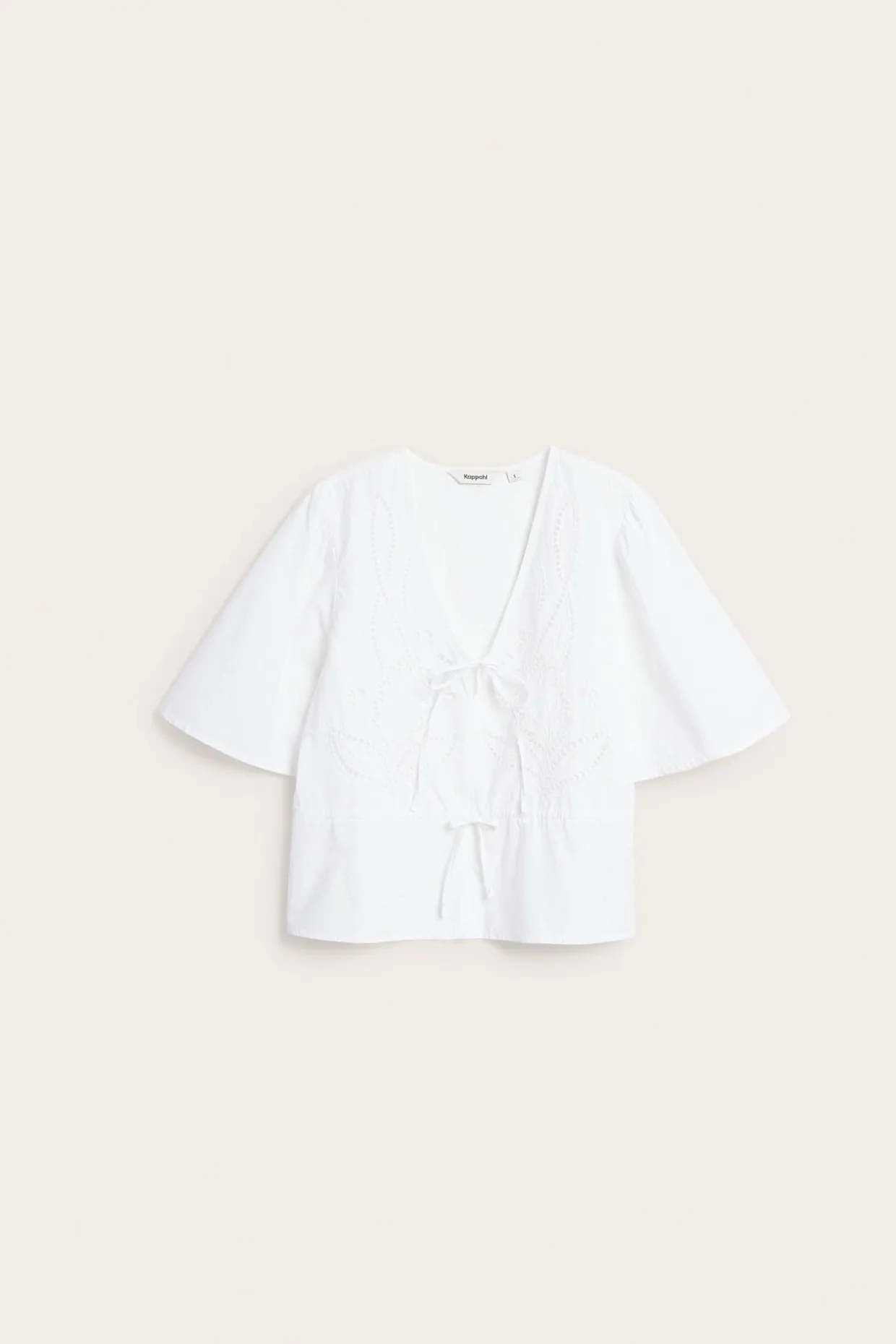 Blus i bomullspoplin med broderi och knytband