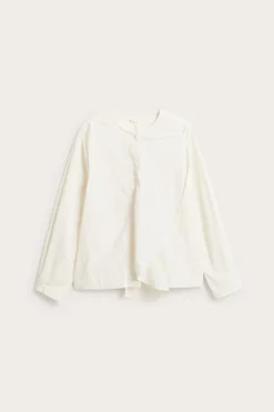 Blus med avtagbar volang