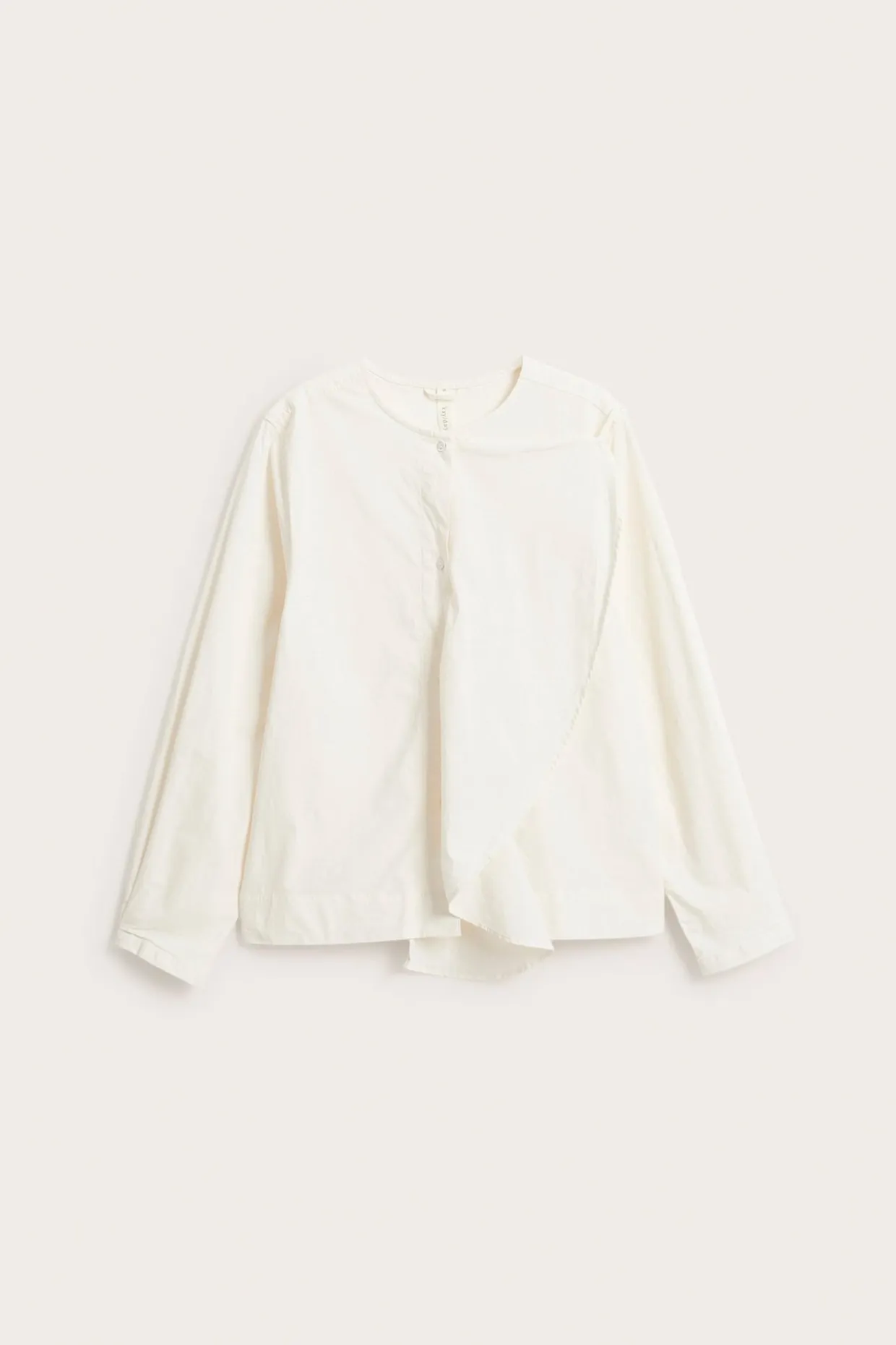 Blus med avtagbar volang