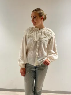 Blus med broderad cape