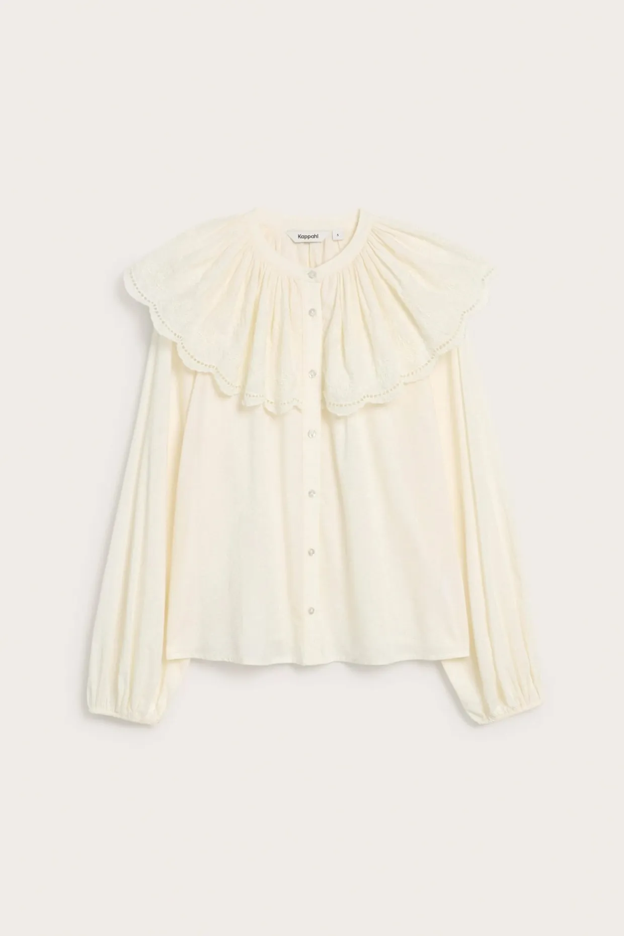 Blus med broderad cape