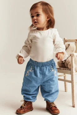 Denimbyxa med blombroderier