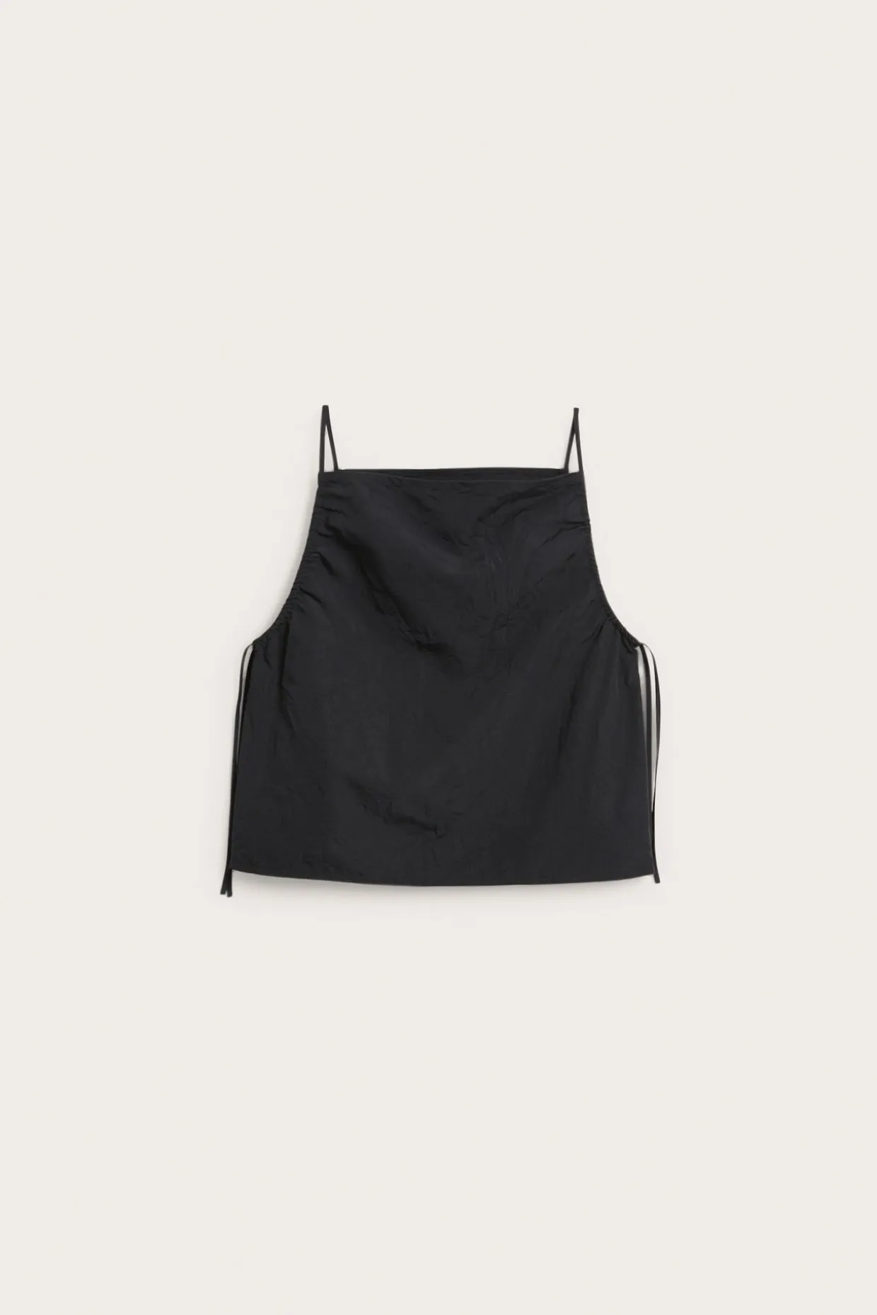 Linne med draperingsdetaljer