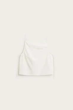 Linne med draperingsdetaljer