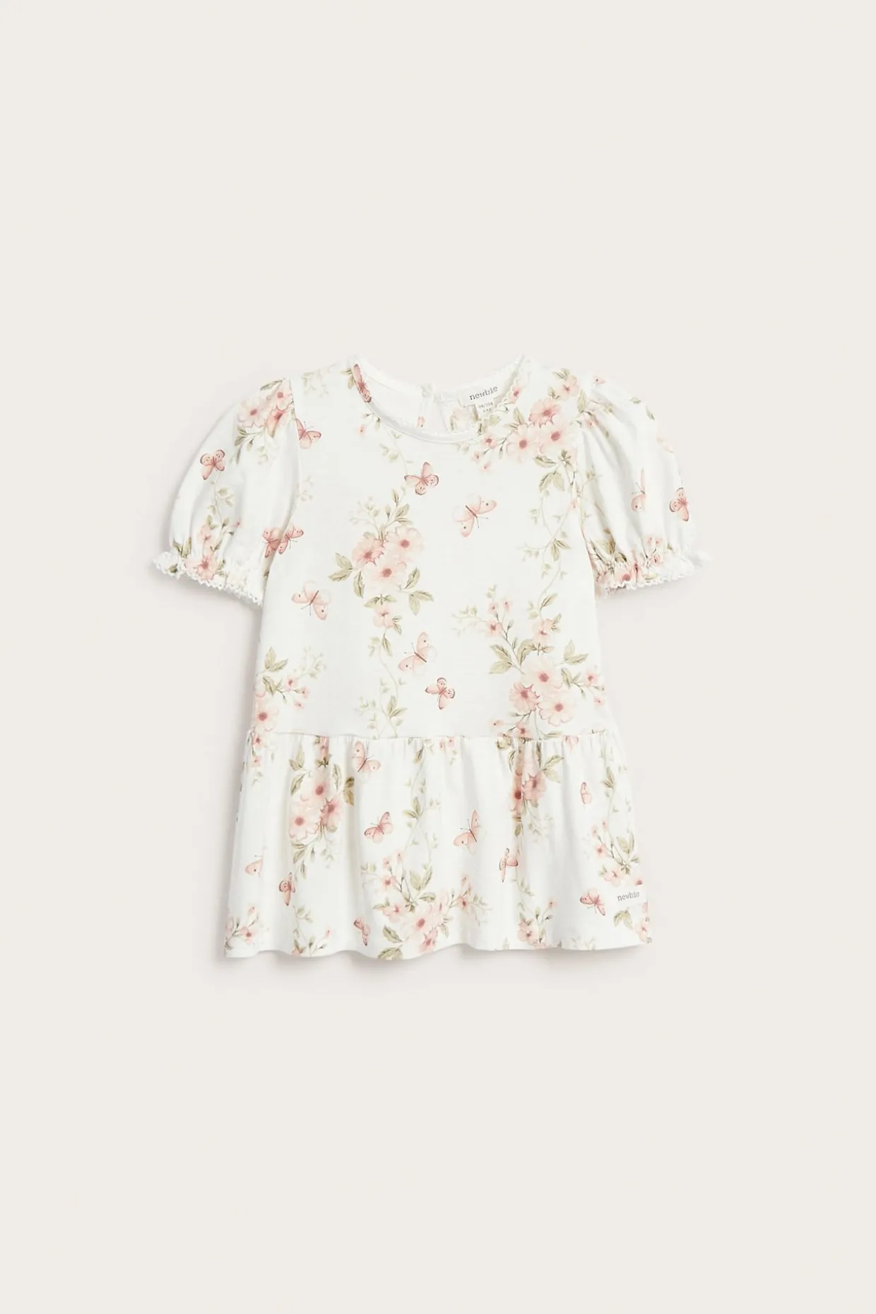 Peplumtopp med blommor och fjärilar