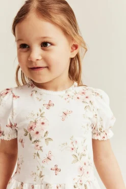 Peplumtopp med blommor och fjärilar