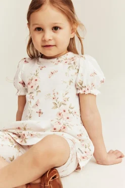 Peplumtopp med blommor och fjärilar