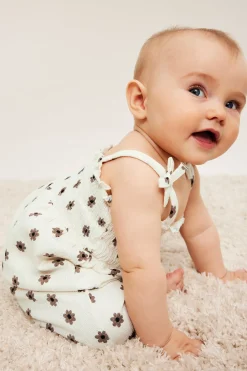 Småblommig jumpsuit med rosetter