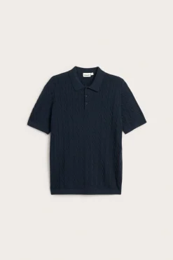 Stickad polotröja med flätmönster