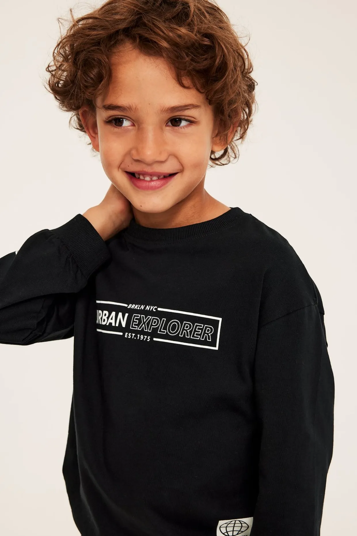 Sweatshirt i bomullstrikå med texttryck