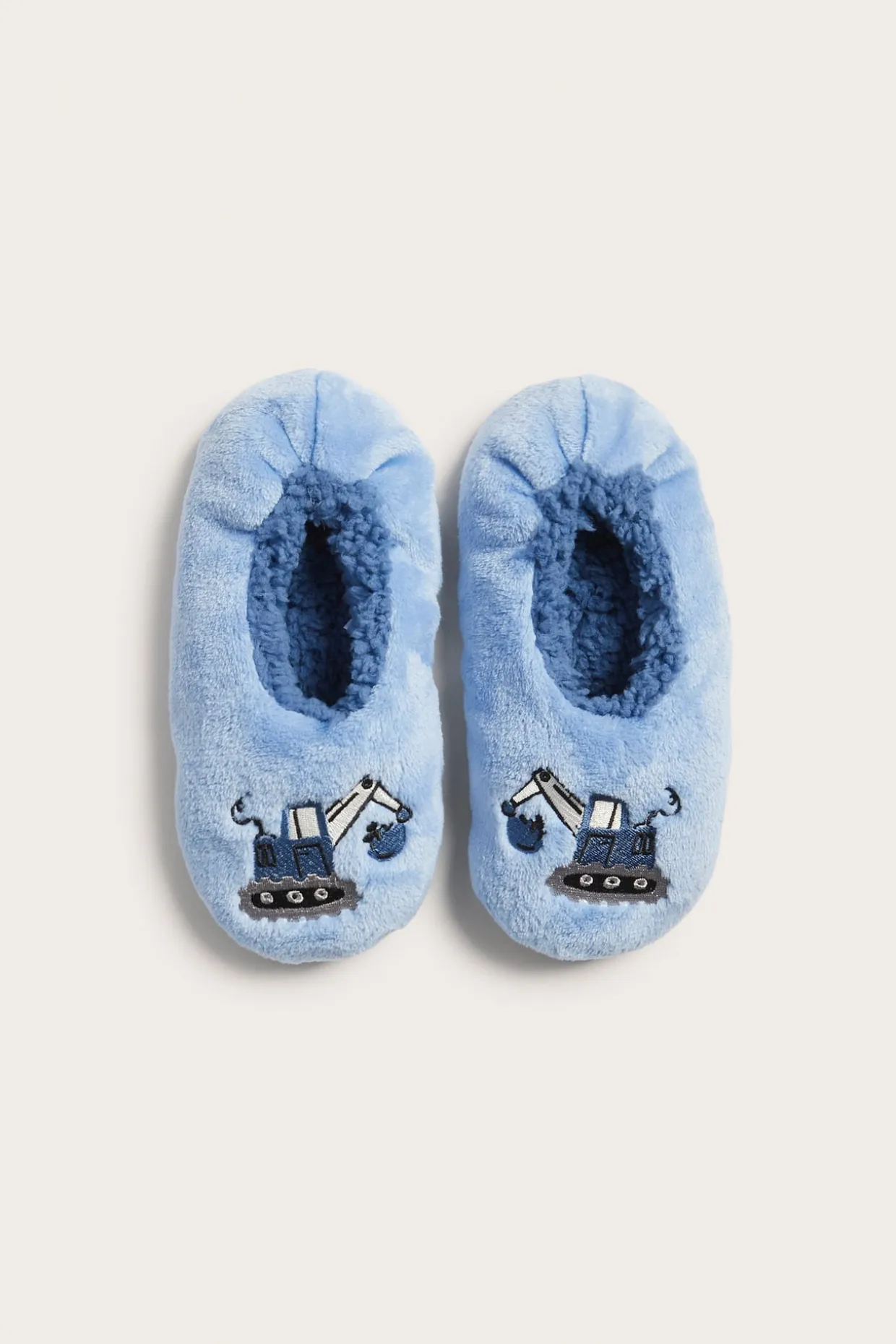 Tofflor med grävmaskin