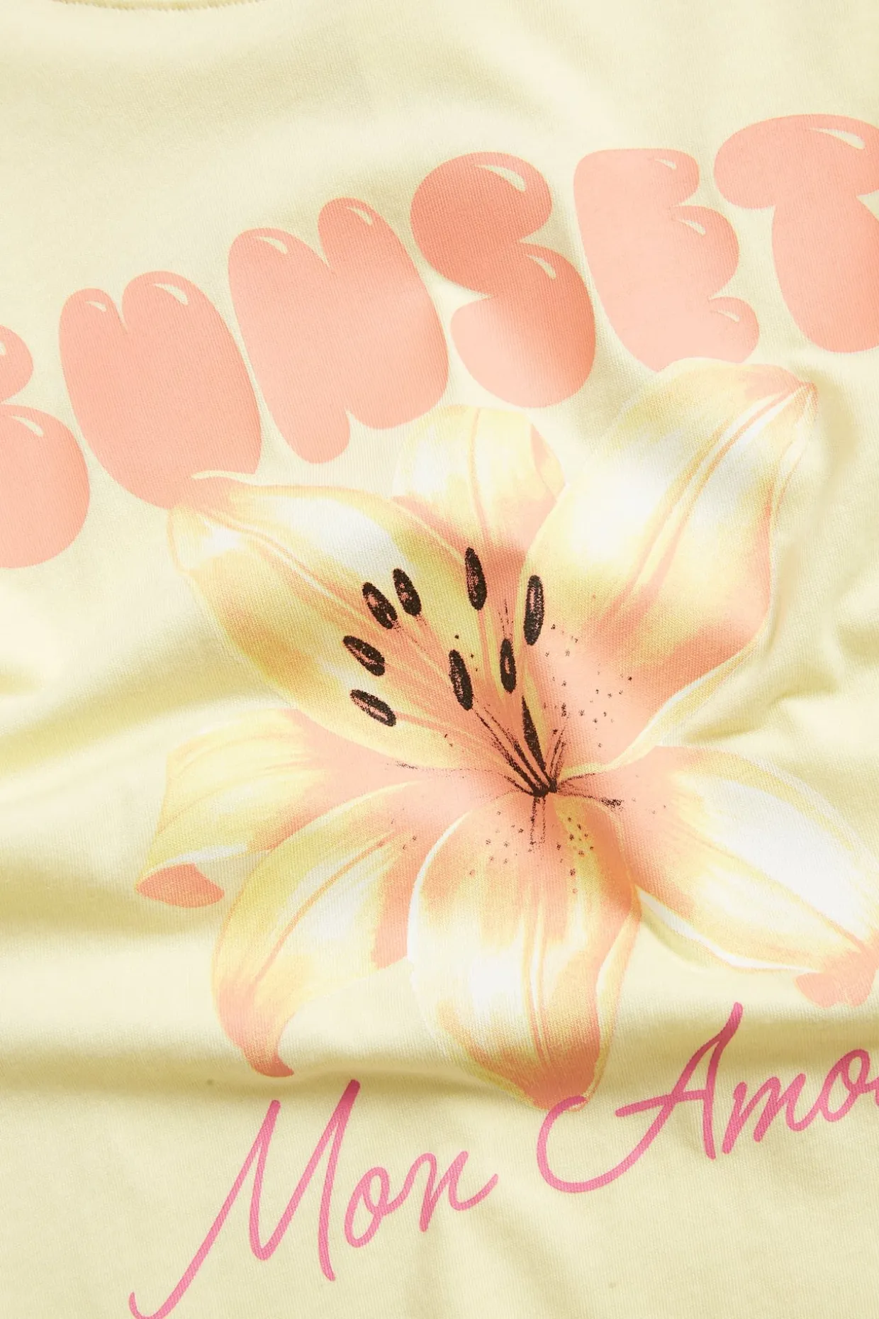 T-shirt med text- och blomsterprint